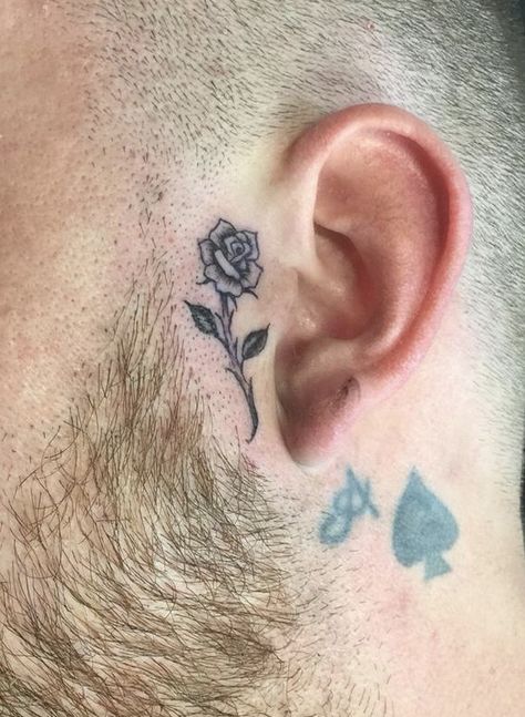 Rose Tattoo By Ear On Face, Rose Sideburn Tattoo, Sideburn Tattoo Ideas, Small Rose Face Tattoo, Small Face Tattoos Men, Small Side Face Tattoo, Pink Face Tattoo, Men’s Face Tattoo, Rose Tattoo On Face