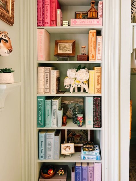 turn board games to display books. Storage solutions that are smart and stylish to organize board games. A beautiful way to keep games on a shelf. A simple craft that is fast and easy Board Game Corner Ideas, Aesthetic Board Game Storage, Board Games Shelf, Bookshelf Board Games, Game Shelf Organization, Playroom Shelf Decor, How To Organize Books, Boardgame Storage, Board Game Shelves