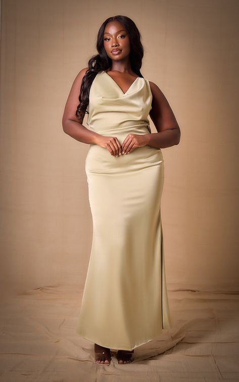 Create a look no one will forget with this dreamy plus sage bridesmaid satin cowl neck extreme maxi dress. With a sage hue satin material, a cowl neck design and a maxi length, this plus dress is her to bring all the luxe vibes. Just add heels and your fave accessories for a look that will earn you all the compliments.   Length approx 155cm/61 (Based on a sample size UK 16)   Model wears size UK 16/ EU 44/ AUS 16/ US 12 One Shoulder Sleeve Dress, Satin Gown Designs, Materials Gown Style, Bridesmaid Satin, Bridesmaid Dresses Satin, Champagne Bridesmaid Dresses, Chic Dress Classy, Elegant Bridesmaid Dresses, Bridesmaid Dress Styles