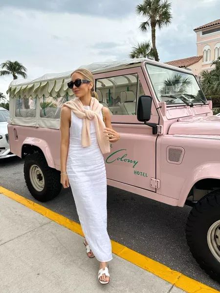 My outfit for a day in Palm Beach! I wore a white linen dress and tied a pink cashmere sweater around the neck (which I packed to wear with jeans too). Tap to shop and bring this fashion inspo to life! White Summer Dress Outfit, White Dress Outfit Summer, Palm Beach Fashion, Beach Style Outfit, Pink Cashmere Sweater, Florida Outfits, Midi Dress Outfit, Palm Beach Style, White Linen Dresses