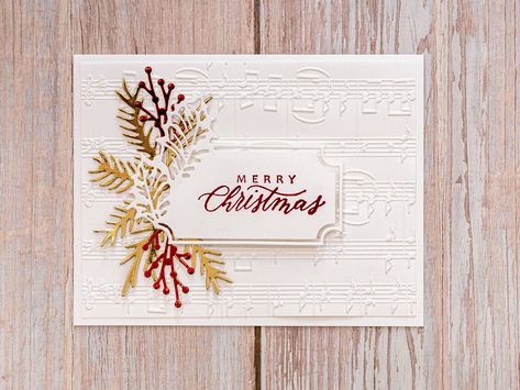 "Wish someone a Merry Christmas with this beautifully elegant red and gold Christmas card! **Please allow slight colour differences due to photography lighting** White embossed music notes are mounted on white cardstock. Various branch shapes are cut out in red and gold foil cardstock. \"Merry Christmas\" is stamped in red and 3D mounted on a holly frame. Inside, there is white cardstock with plenty of room to write your holiday wishes to its recipient. The finished card measures 10.8cm x 21.6cm White And Gold Christmas, Elegant Christmas Cards, Music Card, Anna Griffin Christmas Cards, Red Gold Christmas, Poinsettia Cards, Joy Cards, Unique Christmas Cards, Handmade Christmas Card