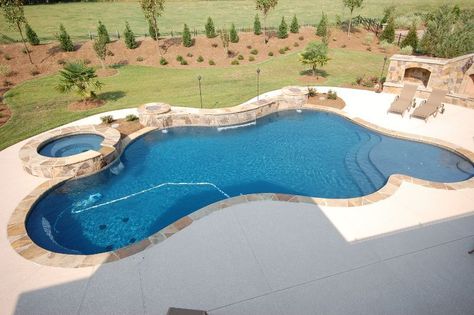 Freeform Pools: Design Ideas, Pros/Cons & More - Pool Research Rectangle Vs Freeform Pool, Odd Shaped Pools, Oasis Pool Backyard, Affordable Inground Pool Ideas, Freeform Pool With Spa, In Ground Pool Ideas, Fiberglass Pool Ideas, Free Form Pools, Freeform Pool Designs