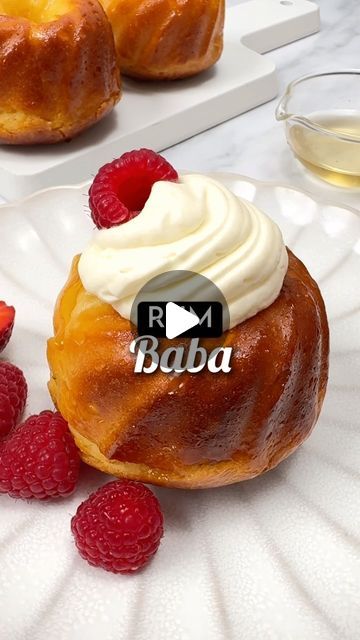 Isabelle Dunn | French Recipes on Instagram: "RUM BABAS 🍹🇫🇷 SAVE the Recipe👇🏼

“Baba au rhum” is one of the most loved cakes in France. Many lay claim to its origins, but it was indeed in Paris that it became the rum baba we know and love today. For an alcohol-free version (also called savarin), simply replace the rum with vanilla or rum essence in the syrup. 

📍to make 12x babas, you’ll need…
7g dried yeast 
½ cup (125ml) warm milk 
½ tbsp sugar 
2-3 tbsp honey 
3.5 cups (420g) plain flour 
½ tsp salt 
170g butter, softened 
4 eggs 
1.5 cups (335g) sugar 
1 cup (250ml) water 
¾ cup (185ml) dark rum 
2 tbsp apricot jam 
1 cup (250ml) cream, whipped 
Berries 
 
⭐️Dissolve yeast and sugar in warm milk. Let sit for 10 minutes until bubbly. Mix flour and salt in a food processor. Add yea Apricot Jam Uses, Baba Au Rhum Recipe, Baba Cake, Rum Baba, Italian Dessert, Double Cream, French Recipes, Apricot Jam, Dark Rum