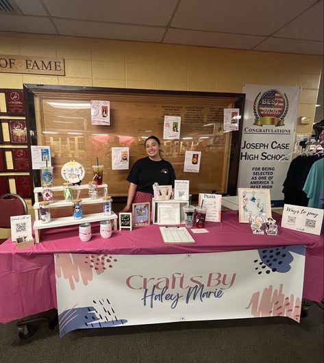 Craft table setup for school craft market! Big banner is a most have along with possible shelves for products and other displays. Also a clothing rack for any apparel or totebags! #crafts #craftfair #craftsman #smallbusiness #shopsmall Vendor Tumbler Display, Tumbler Craft Fair Set Up, Sublimation Vendor Booth, Craft Fair Tumbler Display, Tumbler Display For Craft Show, Vendor Table, Canvas Display, Vendor Booth Display, Vendor Booth