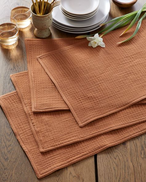 Made from 100% organic cotton, these placemats are not only eco-friendly but also incredibly soft and gentle to the touch. The natural texture of the gauze fabric adds a unique touch to your table setting, and the simple yet elegant design complements any style of dishware. These placemats are also versatile, perfect for use at any meal or occasion, from casual picnics to formal dinners. With their durable construction, these placemats are designed to last, so you can enjoy them for years to com Muslin Table Runner, Japandi Table Setting, Placemat Photography, Placemats Ideas Dining Rooms, Organic Table Setting, Neutral Placemats, Simple Placemats, Modern Thanksgiving, Modern Placemats