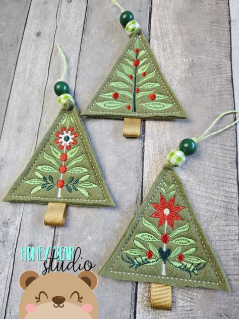 This is a DIGITAL PRODUCT meaning you will not get anything shipped to you. You must have an embroidery machine and be able to transfer files to it to use this product. These folk art Christmas Tree ornaments are designed to stitch on a double layer of felt with a felt backing. They coordinate with our other folk art Christmas files to make your decorating easy. Your file contains a quick step list, a stitch map, and full color tutorial with lots of pictures, and the file to create your own darl Sewing Machine Christmas Ornaments, In The Hoop Embroidery Projects Machine, Cute Ornaments To Make, Christmas Felt Embroidery, Kids Felt Ornaments, Hand Embroidered Felt Ornaments, Denmark Christmas Decorations, Felted Christmas Tree Ornaments, Easy Christmas Sewing Crafts