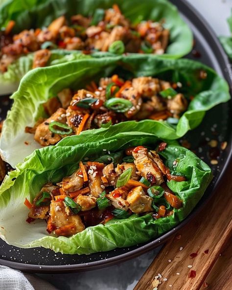 Light, refreshing, and packed with flavor - these Asian Chicken Lettuce Wraps are everything you need for a satisfying meal! Visit website for full recipe at https://northeastnosh.com/f/asian-chicken-lettuce-wraps #northeastnosh #asiancuisine #lettucewraps #thaifood #healthyrecipes #glutenfree #lowcarb #healthydinner #easyrecipes #quickmeals #mealprep #dinnerideas #cleaneating #foodie #homemade #nutrition Sweet Red Chili Sauce, Korean Meals, Asian Chicken Wraps, Thai Lettuce Wraps, Chicken Lettuce Cups, Asian Chicken Lettuce Wraps, Main Entrees, Chicken Lettuce Wraps, Asian Chicken