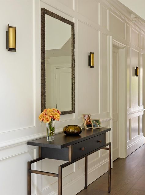 Painted wood panelled hallway with bronze & smoked oak console, brass and bronze wall lights and mirror. Panelled Hallway, Black And White Hallway, Hallway Panelling, Victorian Villa, Entrance Hall Decor, White Hallway, Victorian Hallway, Hallway Wall Lights, Painting Wood Paneling