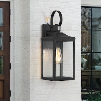 True Fine Norwich 1-Light 18-in H Black Dusk to Dawn LED Outdoor Wall Light in the Outdoor Wall Lights department at Lowes.com Exterior Light Fixture Over Front Door, Black Farmhouse Outdoor Light Fixtures, Black Outside Lights, Outdoor Light Fixtures Garages, Outdoor Wall Lights On House Garage, Door Lights Exterior, Outside Lights Front Door, Garage Door Lights Exterior, Coach Lights Exterior