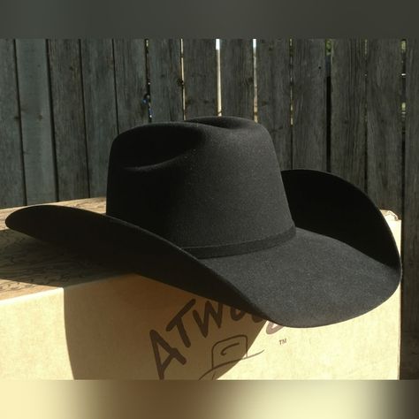 Shop barsevenssupply's closet or find the perfect look from millions of stylists. Fast shipping and buyer protection. Atwood Hat Co. 5X Black Fur Felt Cowboy Hat - 7 1/8 Hard to find and purchased direct from Atwood! Nice black 5X fur felt cowboy hat. Size 7 1/8. This hat is creased with Atwood's 4 3/4" low crown, and a 4" Hereford brim. Self band with silver buckle. Leather sweatband, and pretty purple satin lining. If you want a hat with Atwood's Low Crown crease, it has to be shaped at Black Leather Cowboy Hat, Types Of Cowboy Hats, Cowboy Hat Shapes, Black Felt Cowboy Hat, Best Cowboy Hats, Bling Horse Tack, Felt Cowboy Hat, Nike Golf Hat, King Hat