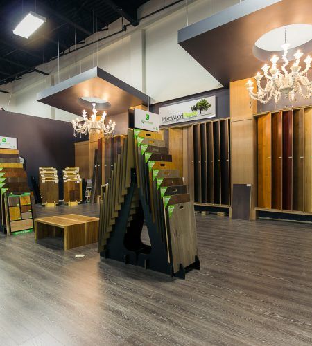 Wooden Flooring Display Showroom, Plywood Store Design, Laminate Showroom Interior Design, Plywood Shop Interior Design, Tile Display Ideas Showroom, Flooring Store Showroom Ideas, Laminate Display Showroom, Flooring Showroom Design, Laminate Showroom