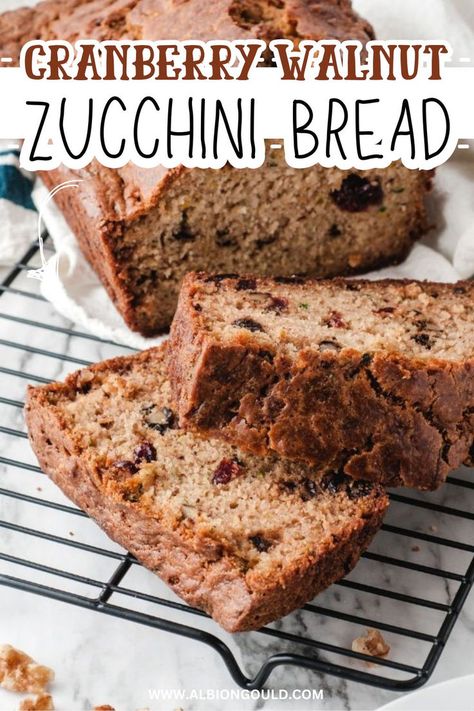 Enjoy the delicious combination of flavors in this cranberry walnut zucchini bread. Moist and flavorful, this easy recipe is perfect for breakfast or a sweet snack. Packed with fresh zucchini, tart cranberries, and crunchy walnuts, it's a must-try for any bread lover. Zucchini Bread Moist, Cranberry Zucchini Bread, Zucchini Tart, Cranberry Walnut Bread, Cranberry Bread Recipes, Fresh Zucchini, Walnut Bread, Cranberry Bread, Measuring Ingredients