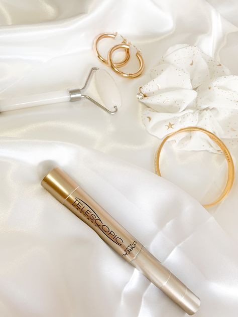 L’Oréal Paris telescopic mascara layout accessorized with gold hoop earrings, a marble skin roller, a white and gold scrunchie & a gold bracelet Mascara Aesthetic, Timeless Makeup, Telescopic Mascara, Mascara Review, Diy Skin Care Routine, Lengthening Mascara, Diy Skin, Diy Skin Care, Loreal Paris