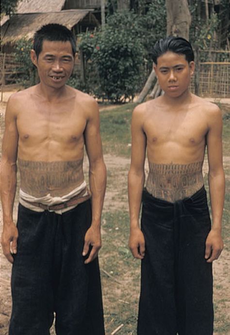 Two Laotian Kammu (Khmu') males with  tattooed midsections. The Kammu feel their tattoos enhance the prestige of an individual and they give the person protection from spirits who might otherwise "devour" a person. Their tattoos are regarded as poison to the spirits. circa 1957 #VanishingTattoo #VintageTattoos #TattooHistory Cultural Tattoos For Women, Austronesian Tattoo, Laotian Tattoo, Lao Tattoo, Protection From Spirits, Worldwide Tattoo, Tattoo Museum, G Tattoo, Ancient Tattoo