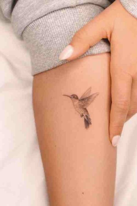 Tiny But Mighty - Hummingbird Tattoo Guide (70+ Examples!) - Tattoo Stylist Humming Bird And Flower Wrist Tattoo, Hummingbird Daffodil Tattoo, Hummingbird Tattoo Ear, Hummingbird Tattoo Meaning For Women, Hummingbird Sketch Tattoo, Hummingbird Feeder Tattoo, Hummingbird Wings Tattoo, One Line Hummingbird Tattoo, Hummingbird Hip Tattoo