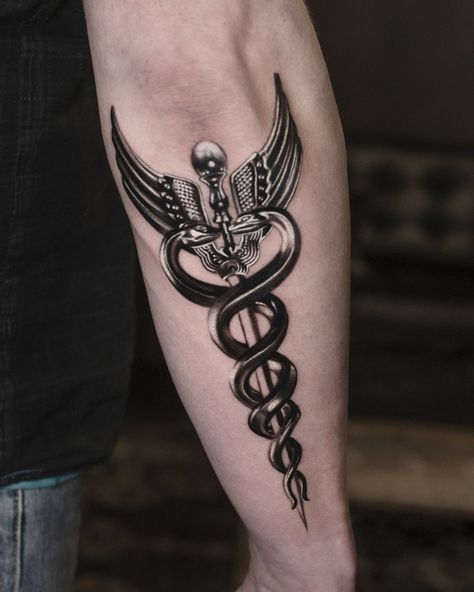 The caduceus, featuring two snakes wrapped around a staff, is an ancient and powerful symbol used in mythology and medicine. Getting a caduceus tattoo... Hermes Caduceus Tattoo, Staff Of Caduceus Tattoo, Staff Of Hermes Tattoo, Caduceus Tattoo Men, Medical Staff Tattoo, Hermes Staff Tattoo, Cadeusus Tattoo Design, Emergency Medicine Tattoo, Medicine Symbol Tattoo