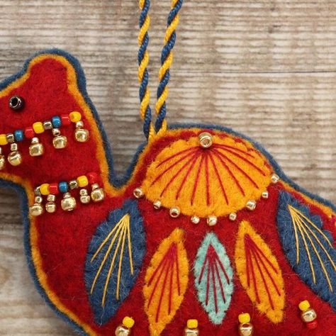 Chloe on Instagram: "Some close-ups of this red camel who I recently listed in my shop 🥰 Camels are one of my favourites to make 🐪 #felt #feltapplique #feltembroidery #feltcollage #feltartist #ilovefelt #christmasdecorations #christmasornaments #winter #winterdecoration #folkartindpired #handmade #craft #smallbusiness #shopsmall #etsy #etsysellersofinstagram #camel #cameldecoration #camelornament" Felt Embroidery, Red Embroidery, Felt Applique, Felt Ornaments, Winter Decor, Christmas Ornament, Chloe, Camel, I Shop