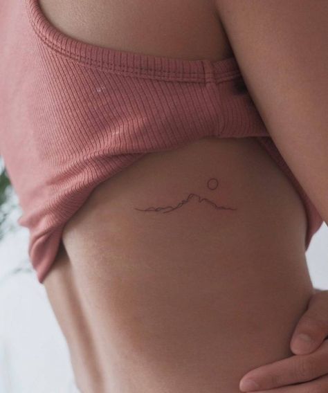 Minimalist mountain tattoo on the rib. Minimalist Mountain Tattoo, Community Tattoo, Small Mountain Tattoo, Berg Tattoo, 27 Tattoo, Small Rib Tattoos, International Tattoo, Rib Tattoos For Women, Minimalist Mountain