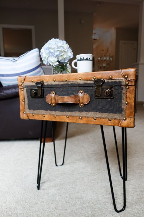 How To Make A Side Table From A Vintage Suitcase We found a vintage suitcase a few weeks ago at a thrift store and it was the perfect size for a side table or nightstand.  We found some affordable metal hairpin table legs on Amazon and attached them to the suitcase to create a super easy side table or nightstand. Suitcase Table Diy, Diy Vintage Suitcase, Suitcase Furniture, Vintage Suitcase Decor, Table Legs Diy, Vintage Suitcase Table, Hairpin Table Legs, Suitcase Table, Suitcase Decor