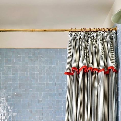 Louise Roe Home on Instagram: "I love how the red-rim mirror reflects the pop of red on the shower curtain. This beautiful bathroom full of contrasting textures and surfaces, & featuring an antique vanity by @howelondon is by @lonikachande shot by @milobrown_photography" Antique Washstand, Pretty Shower Curtains, Pastel Bathroom, Elizabeth Street, Antique Vanity, Pop Of Red, Great Bathrooms, Heated Towel Rail, Heated Towel