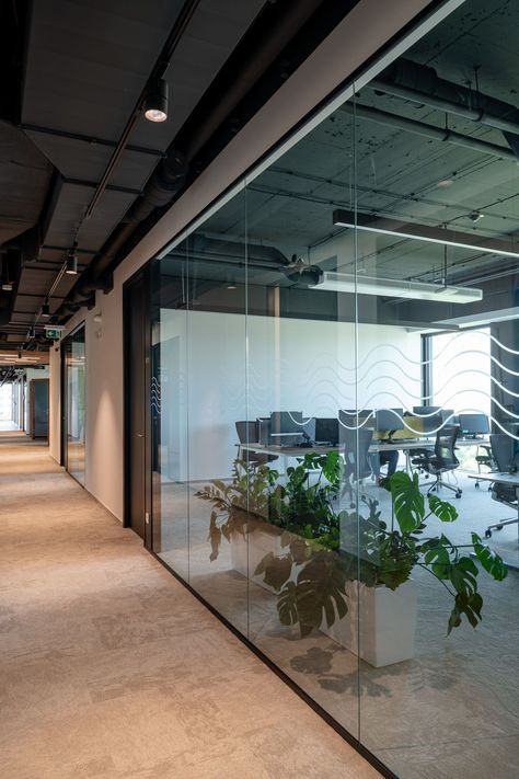 "When designing Softec's interiors, it was very important for us to understand the client's needs first. We used MICRA II double-glazed partitions, which met all the criteria to meet the client's acoustic requirements while having a simple, elegant frameless design,“ says Ing. arch. Simona Brenčičová from the architectural team of the Bratislava studio CBRE. #design #architecture #glass #partitions #doubleglazed #micrapartitions #acoustic #office Healthy Office, Movable Walls, Green Companies, Interior Staircase, Information Systems, Glazed Walls, Interactive Walls, Glass Partition, Moss Wall