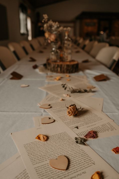 Using fairytale book pages for a table running at our Love Story wedding - Whimsical Our Story Table, Mystery Wedding Theme, Book Pages Table Decor, Book Wedding Arch, Wedding Book Decorations, Love Story Theme, Book Table Centerpieces Wedding, Wedding Book Table Ideas, Fairytale Inspired Wedding