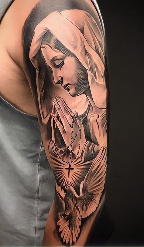 60+ Virgin Mary tattoo ideas: designs on different parts of the body in various styles with pain evaluation. Bonus: a detailed explanation of the meanings. Christus Tattoo, Mother Mary Tattoos, Tato Flash, Mens Body Tattoos, Tato Salib, Michael Tattoo, Catholic Tattoos, Virgin Mary Tattoo, Chicano Tattoos Sleeve