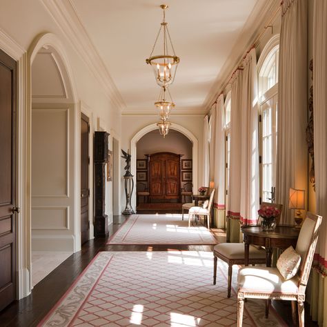 The long gallery hall across the back of the home leads to a two-story panelled library at one end and a kitchen and family area at the other. Manor House Interior, Manor Interior, English Estate, Estate Interior, English Manor Houses, English Interior, English Manor, English House, Country Estate