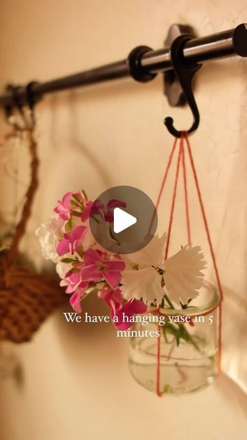 Style Estate Gardens on Instagram: "DIY Hanging Vase: Add a Touch of Handmade Charm to Your Space 🌷✂️  Transform any corner of your home with a simple and sweet DIY hanging vase! All you need is a clean glass jar (like an empty Oui yogurt jar), some yarn, and a bit of creativity.  Here’s how to make it:  	1.	Cut a length of yarn long enough to wrap around the neck of your jar with extra to hang. 	2.	Secure the yarn around the jar’s neck with a knot, creating a harness. 	3.	Tie the ends together to create a loop for hanging. 	4.	Add water and your favorite flowers, then hang it up for a delightful display!  Perfect for springtime vibes or a thoughtful handmade gift!  #DIY #Crafty #Handmade #HomeDecor #CreativeLife #ArtAndCraft #DoItYourself #HomeStyling #CraftsOfInstagram #DIYProject #Inst How To Tie A Mason Jar To Hang, Mason Jar Plants, Oui Yogurt, Estate Gardens, Hanging Jars, Hanging Vase, Hanging Vases, Repurposed Items, Gift Diy