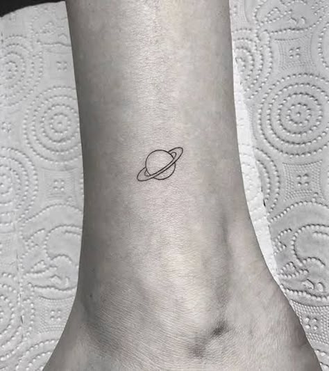 Saturn Wave Tattoo, Saturn Simple Tattoo, Simple Jupiter Tattoo, Small Moon And Saturn Tattoo, Minimalist Tattoo Saturn, Saturn Tattoo Fine Line, Minimalist Universe Tattoo, Saturn Outline Tattoo, Dainty Planet Tattoo