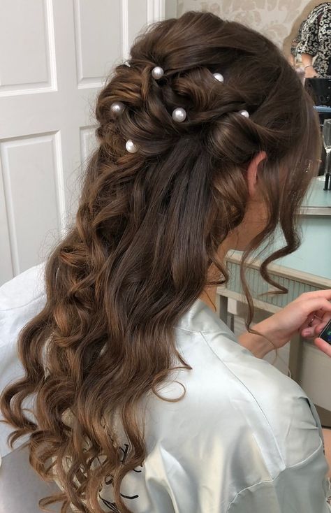 Are you looking for inspiration for curly wedding hair or wavy hairstyles?  ⁠ How about this gorgeous style? A few delicate pearl accessories help to create this look which is a unique on the half up, half down look.  ⁠ #gettingmarried #syrencot #wiltshireweddings #BridalHair   #weddingdayhair   #weddinghair #modernbride #realweddings #BestDayEver  ⁠#realbrides #weddingshairstyles #hairstyle #hairstylist #bridetobe #hairgoals #weddingideas #weddingplanning Wedding Half Hair Up, Braid With Pearls Wedding Hairstyles, Pearls In Half Up Half Down, Half Up Half Down Bridal Hair With Pearls, Bridal Hair With Pearl Pins, Wedding Hairstyles Half Up Half Down With Pearls, Pearl Wedding Hair Half Up, Half Up Half Down Wavy Hair Prom, Wedding Hairstyles For Long Hair With Pearls