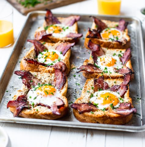 Sheet Pan Egg In A Hole - TableandDish Egg In A Hole Avocado Toast, Frog In A Hole Breakfast, Egg Hole Toast, Baked Egg In A Hole, Eggs In Toast Hole, Egg In Toast Hole Oven, Egg In Hole Toast, Eggs In A Hole Recipe, Toast With Egg In The Middle