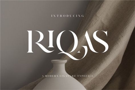 Riqas Ligature Serif Font inspired by the famous minimalist logo perfect for the purposes of designing templates, brochures, videos, advertising branding, logos, invitation, layout design, elegant crafting, beauty design and more. Try before you buy Riqas font for iOS, Android, macOS, or Windows for free, or you can download the full version with a commercial […] Get your free download of the Riqas Font now at FreeFontDL - Free Font Download! Elegant Fonts For Logo, Elegant Free Fonts, Elegant Font Logo, Minimalist Typeface, Elegant Fonts Free, Logo Fonts Free, Elegant Invitation Design, Typography Logo Fonts, Beautiful Serif Fonts