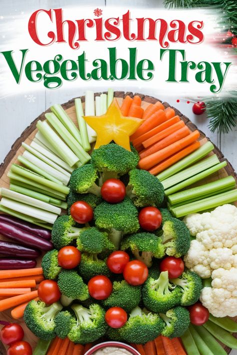 Christmas-themed vegetable tray shaped like a tree, decorated with broccoli, cherry tomatoes, and a star-shaped pepper slice, surrounded by carrots, celery, and cauliflower. Veggie And Meat Tray, Veggie Santa Face, Decorating With Vegetables, Veggie Tray Ideas Parties Vegetable Platters Fun, Ideas For Veggie Trays, Christmas Appetizers Veggie Tray, Christmas Tree Shaped Veggie Tray, Christmas Veggie Tray Holiday Parties Vegetable Platters, Christmas Veggie Trays Ideas