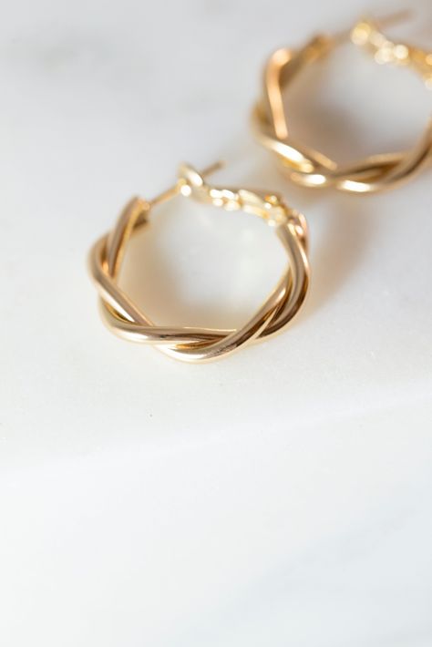 [PaidLink] Our Dainty Twisted Hoop Earrings Are A Perfect, Minimalist Earrings To Add To Any Outfit! Made With 14K Gold Filled Metal, And Measure 27Mm X 28Mm. Available In Gold. Lead And Nickle Free. #goldminimalistjewelry Twisted Gold Hoop Earrings, Gold Hoop Earrings Aesthetic, Girly Jewellery, Trendy Gold Earrings, Good Earrings, Hoop Earrings Aesthetic, Minimal Hoop Earrings, Twisted Earrings, Layer Jewelry