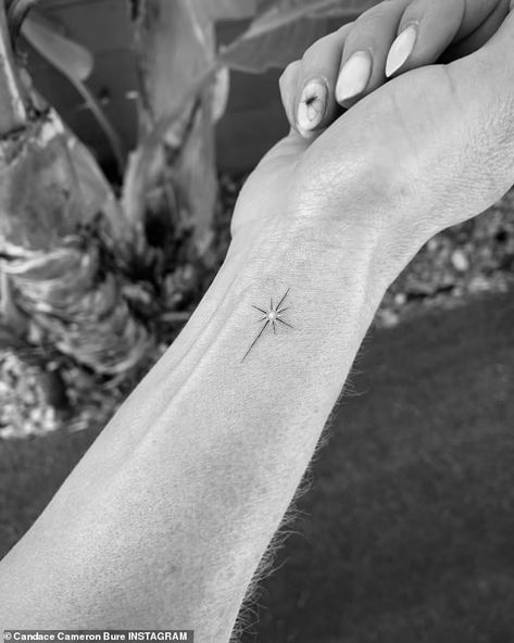 Candace Cameron Bure shows off new cross tattoo on the inside of her wrist | Daily Mail Online Delicate Cross Tattoo For Women, Dainty Cross Tattoos For Women, Tattoo Amigas, North Star Tattoo, Star Tattoo On Wrist, North Star Tattoos, Sparkle Tattoo, Small Star Tattoos, Cross Tattoos For Women