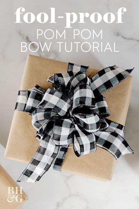 Whether you're wrapping Christmas gifts for the family or embellishing a birthday package, we'll show you how to make a pom pom bow. This might be the easiest bow you've ever made. #howtomakeabowwithribbon #giftwrapping #pompombow #bowforagift #christmas #bhg Diy Bow With Wired Ribbon, Wire Edged Ribbon Bow Diy, How To Make A Pom Pom Bow, Pom Pom Bows Diy, Wire Bows Diy, How To Make A Wire Ribbon Bow, Easiest Way To Make A Bow, Making A Bow With Wire Ribbon, Diy Gift Bow Ribbon