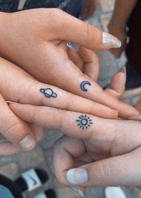 A sun moon and planet finger tattoo Cousin Trio Tattoos, Small Matching Tattoos For Friend Group, Friendship Tattoo Ideas For 3, Tattoo Ideas 3 People, Cute Mini Matching Tattoos, Tattoo Ideas For A Trio, Tattoo Ideas Female 3 Friends, Trio Finger Tattoos, Small Matching Tattoos For 3 People