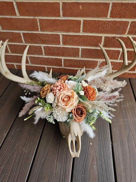 Deer Skull Crafts, Crafts With Antlers, Deer Skull Display, Cow Skull Decorating Ideas, Diy Deer Head Decor, Deer Shed Decor, Unique Deer Mounts, Cow Skull Decor Living Room, Deer Skull Wedding Decor