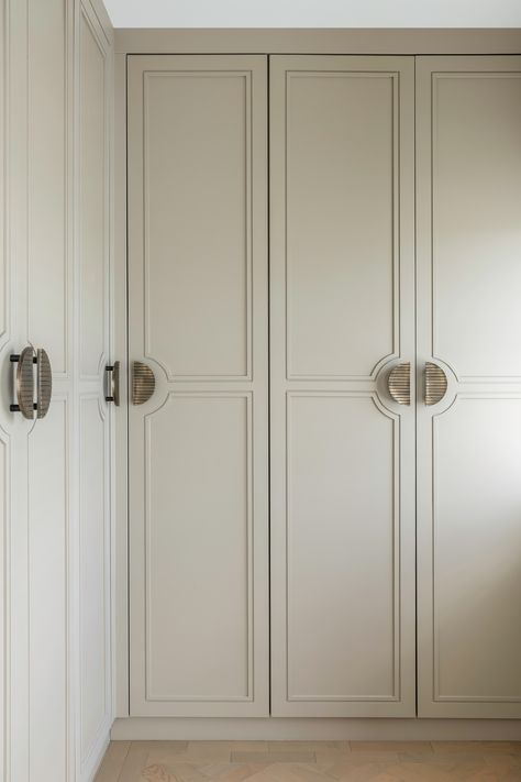 Bespoke dressing room wardrobes sprayed to match Lick Taupe 01. Antique brass handles with groved shaker designed around them. Photography: Leigh Dawney Photography / www.leighdawneyphotography.com Flushed Wardrobe Design, Wardrobe With Moulding Design, Taupe Dressing Room, Modern Closet Door Handles, Classic Dressing Room Design, L Shaped Built In Wardrobe, Wardrobe Design Aesthetic, Built In Wardrobe Colour Ideas, Vintage Closet Doors