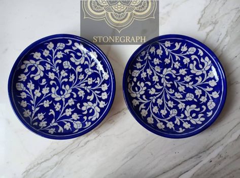 Jaipur blue pottery is world-renowned art. This is completely handmade pottery from product making to painting. Jaipur blue pottery is now worldwide used by many people cause of its attractive designs and handmade work. #bluepottery #jaipurbluepottery #pottery #art #artisans #handmade #plates #tray #bowls #tiles #vocals #vocalforlocal #localforvocal #stone #stonegraph Jaipur Blue Pottery Design, Jaipur Pottery, Blue Pottery Jaipur, Blue Pottery Designs, Aesthetic Building, Handmade Plates, Pink City, Blue Pottery, Plate Art