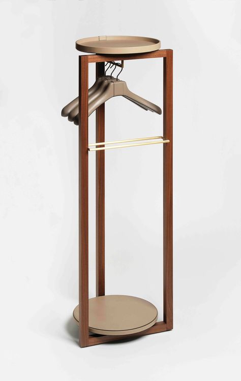 Elegant, sumptuous, linear. Our Achille valet stand is entirely made with valuable walnut wood structure, enriched with brass finishes and completed with two genuine leather trays. A design masterpiece for suits, shirts and trousers perfect for a bedroom or guest rooms. Clothes Valet, Office Hub, Living Room Unique, Valet Stand, Fireplace Set, Wood Clothes, Leather Tray, Jewelry Organizer Storage, Stationery Storage