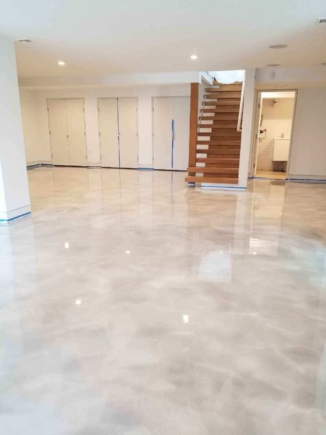 White Concrete Floors Living Room, Basement With Epoxy Floor, Light Epoxy Floor, Basement Rugs Concrete Floors, White And Gold Epoxy Floor, Beige Epoxy Floor, Metallic Epoxy Floor Living Room, Matte Epoxy Floor, Epoxy Basement Floor Ideas