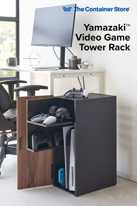 Transform your gaming space with the Yamazaki Game Room Storage Cabinet, designed to organize your gaming gear. This all-in-one cabinet features two spacious pull-out shelves, perfect for storing consoles, controllers, and accessories, keeping your gaming area tidy. The elegant wooden front panel, magnetic closure, and minimalist steel exterior blend seamlessly with any living room or game room décor, adding a refined touch to your setup. Game Room Storage, Video Game Console Storage, Game Console Storage, Gaming Area, Gaming Space, Pull Out Shelves, Console Storage, The Container Store, Stylish Storage Solutions