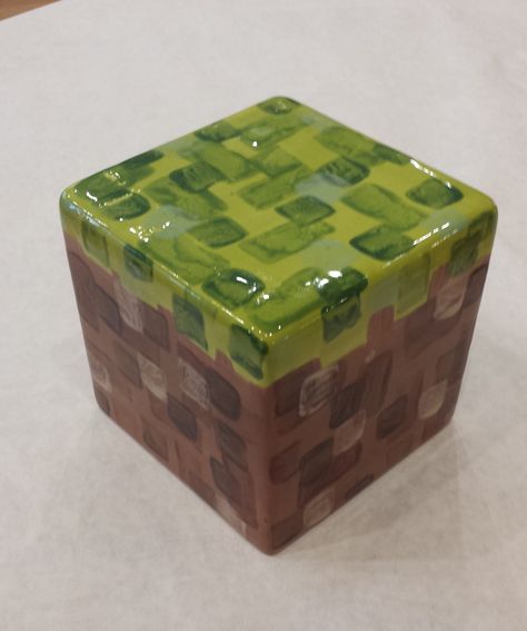 Minecraft block bank made at Color Me Mine Bethlehem PA Ceramic Bank Ideas, Pottery Minecraft, Minecraft Clay Art, Minecraft Ceramics, Funky Pottery Ideas, Pottery Box Ideas, Minecraft Pottery, Box Ceramics Ideas, Ceramic Minecraft