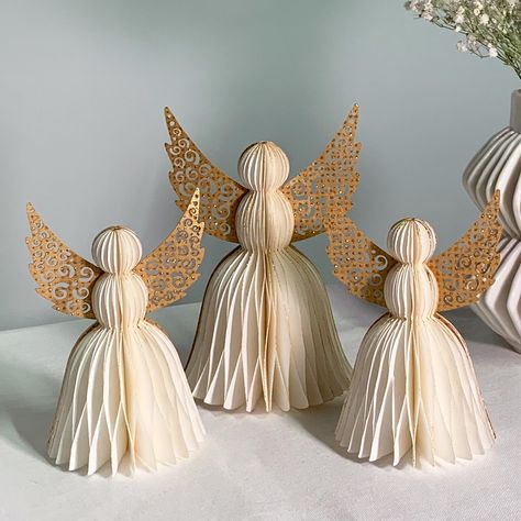 PRICES MAY VARY. CLASSIC ANGELS: Celebrate in style with our modern take on honeycomb party decorations. The white paper angels are trimmed in gold glitter for a festive look. | Set of 3 ( 2 Small, 1 Medium) EASY ASSEMBLY: Thanks to the hidden magnetic closure, the paper angels can be assembled in seconds. | Dimensions: 3.25"D x 5"H and 4"D x 6"H. REUSABLE: Made of sturdy paper, these religious party decorations can be easily folded up and stored for many holiday seasons to come. UNIQUE, VERSATI Clothespin Angels Ornament Napkin Method, White And Gold Christmas Table With Angels, Christian Christmas Table Centerpieces, Toilet Paper Angel, Angel Centerpieces, Christening Table Decorations, Communion Table Decorations, Winter Table Decorations, Fairy Party Decorations