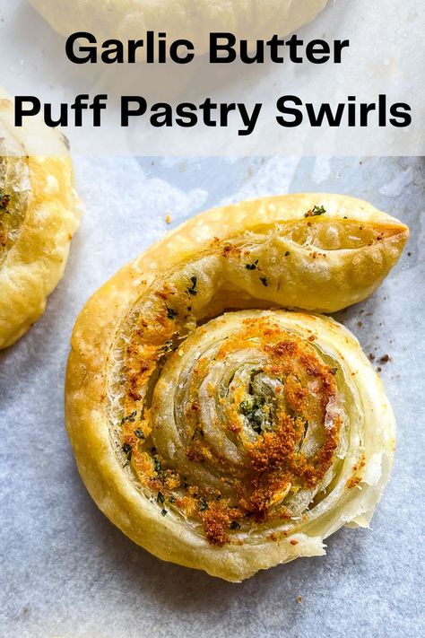 Garlic butter puff pastry swirl on a sheet pan. Garlic Puff Pastry Recipes, Puff Pastry Garlic Knots, Garlic Bread Puff Pastry, Garlic Puff Pastry, Puff Pastry Garlic Twists, Puff Pastry Garlic Bread, Butter Puff Pastry Recipes, Parmesan Puff Pastry, Parmesan Puffs