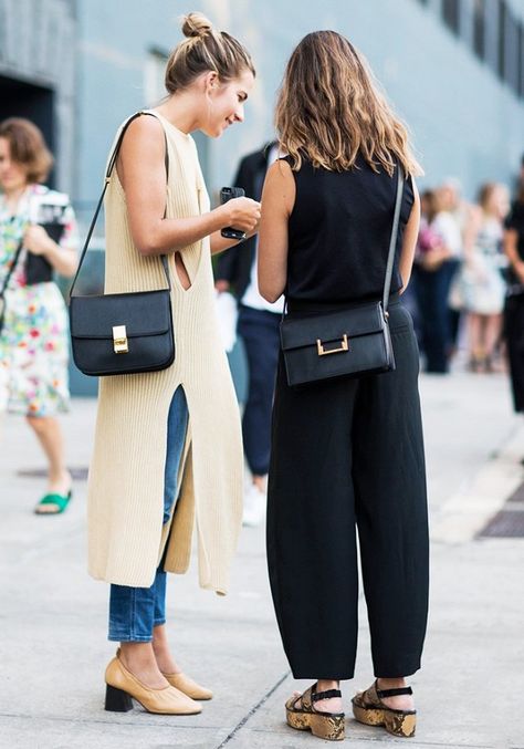 Left, a knit neutral dress is worn over cropped jeans, paired with neutral Céline heels and a Céline bag. Right, a black top is worn with black loose trousers, flat sandals, and a flap bag Split Sweater, Beige Outfit, Looks Street Style, Street Style Inspiration, Looks Chic, Inspired Outfits, Fashion Week Street Style, 가을 패션, Inspiration Mode