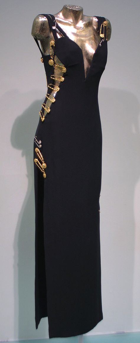 Evening gown worn by Elizabeth Hurley, Spring-Summer 1994, Versace, black viscose and acetate with kilt pin embellishments Versace Black Dress, Vintage Versace Dress, Black Versace Dress, Versace Aesthetic, Safety Pin Dress, Versace Safety Pin, Versace Design, Pin Dress, Versace 90s