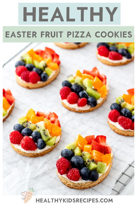 These colorful fruit Easter eggs are the perfect dessert for your Easter meal! Each of the Easter fruit pizza cookies is made with a healthier sugar cookie base naturally sweetened with maple syrup. Then, they’re topped with a delicious cream cheese frosting, and your kid’s favorite fruits arranged to look like Easter eggs. They’re perfect for Easter brunch or a healthier holiday dessert! Easter Egg Fruit Pizza Recipe, Easter Fruit Desserts, Egg Shaped Fruit Pizza, Easter Fruit Pizza, Egg Fruit Pizza, Individual Fruit Pizza, Fruit Easter, Easter Egg Fruit Pizza, Bday Treats